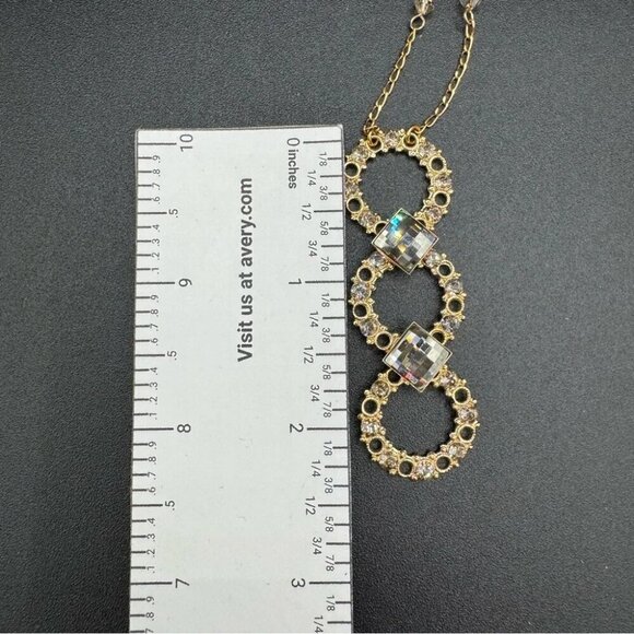 Belladonna Circular Crystal and Gold Tone Infinity Pendant Necklace - Picture 6 of 17
